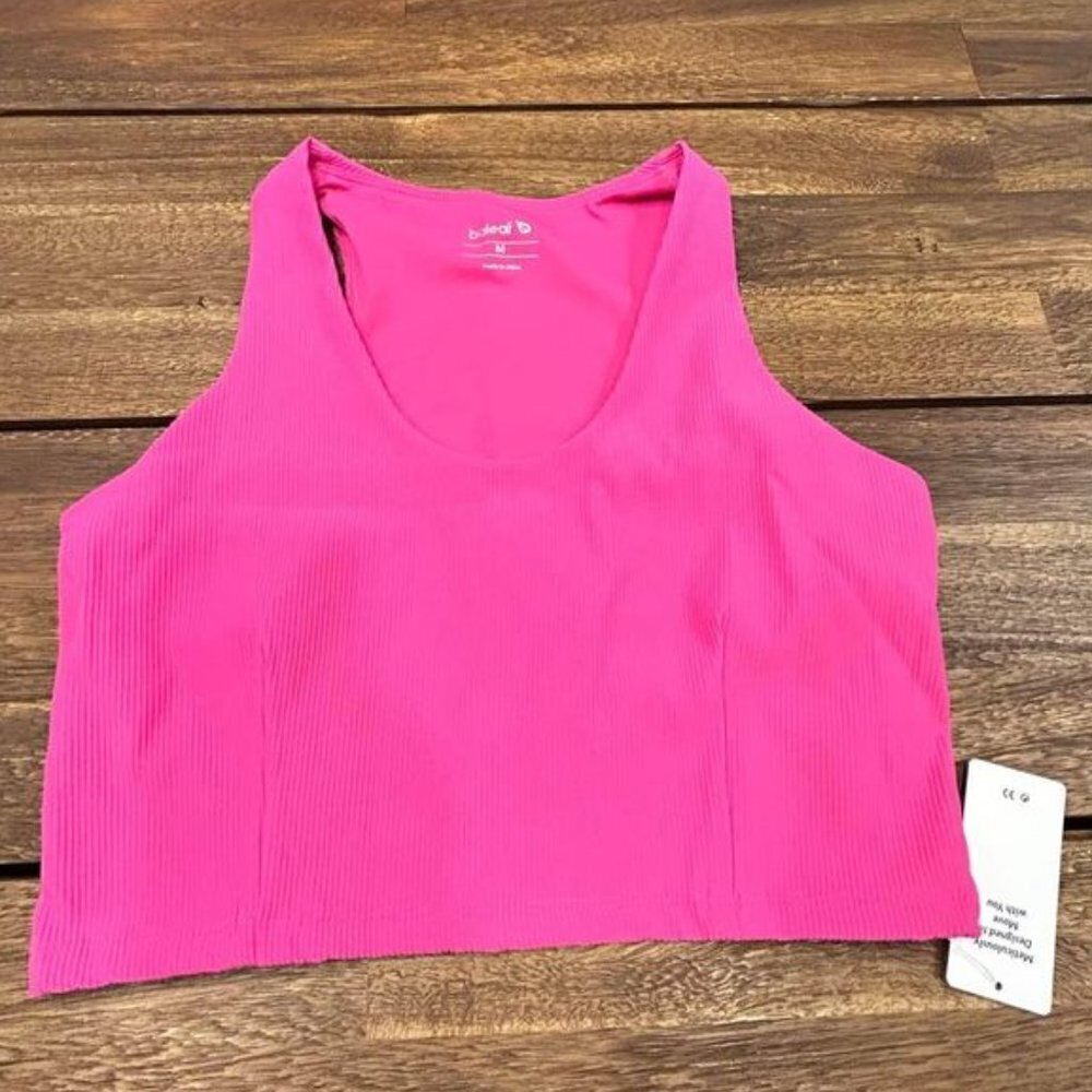 Woman’s hot pink, high front, ribbed and lined workout top. Size medium. New wit